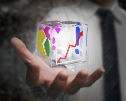 businessman hand holding colorful transparent glass cubic